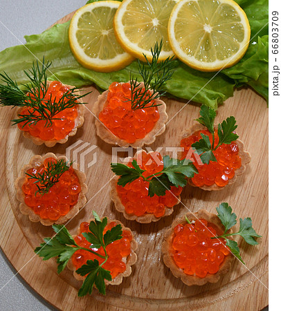Tartlets with red caviar 66803709