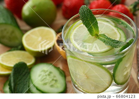 Delicious fresh mojito and limes on table Delicious fresh mojito and limes on table 66804123