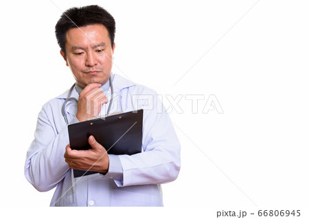 Studio shot of Japanese man isolated against white background Studio shot of Japanese man isolated against white background 66806945