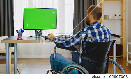 Handicapped person in front of green screen 66807068