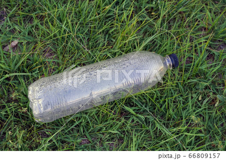 used plastic bottle as garbage on the grass, 66809157