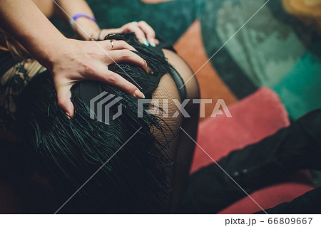 a girl takes off a dress the sexual undresses. a girl takes off a dress the sexual undresses. 66809667