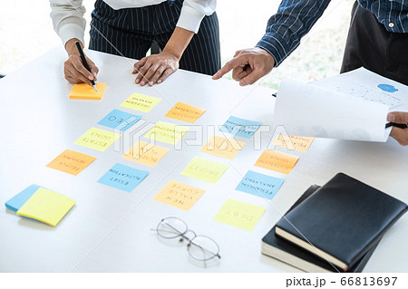 Two creative business people meeting and planning Two creative business people meeting and planning 66813697