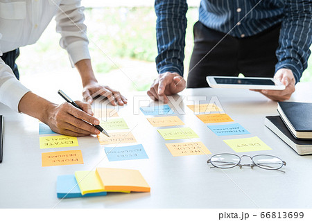 Two creative business people meeting and planning 66813699