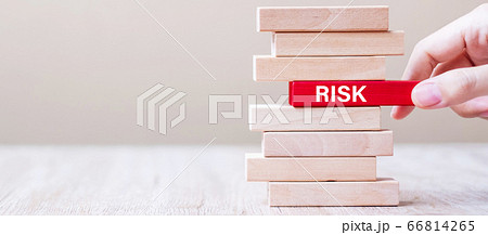 Businessman hand placing or pulling wooden block Businessman hand placing or pulling wooden block 66814265