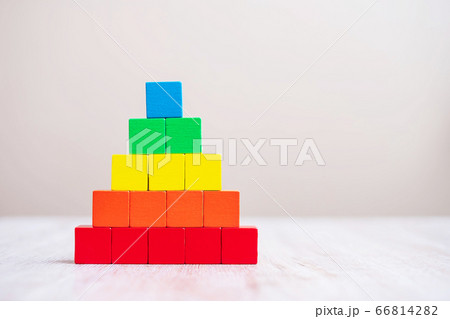 Colorful wooden cube blocks on table background Colorful wooden cube blocks on table background 66814282