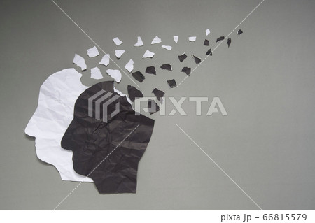 Bipolar disorder presented by human head made from black&white crumpled paper torn on gray background w/ copy space. Manic and depress emotion. Mental health, brain disorder and psychological concept. Bipolar disorder presented by human head made from black&white crumpled paper torn on gray background w/ copy space. Manic and depress emotion. Mental health, brain disorder and psychological concept. 66815579