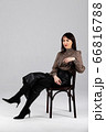 Woman in blouse and culottes on white 66816788