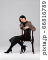 Woman in blouse and culottes on white 66816789