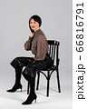 Woman in blouse and culottes on white 66816791