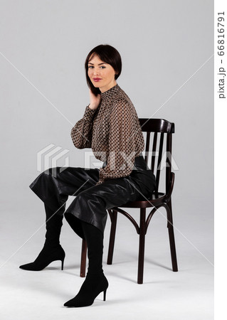 Woman in blouse and culottes on white 66816791