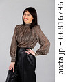 Woman in blouse and culottes on white 66816796