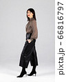 Woman in blouse and culottes on white 66816797