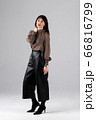 Woman in blouse and culottes on white 66816799