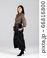 Woman in blouse and culottes on white 66816800