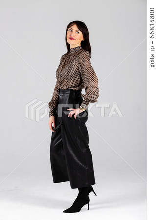 Woman in blouse and culottes on white 66816800
