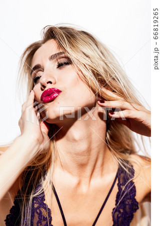 emotions and feelings concept - beautiful blond lady portrait in sexy lingerie while getting an orgasm on white background. Woman shouts in ecstasy in bright light emotions and feelings concept - beautiful blond lady portrait in sexy lingerie while getting an orgasm on white background. Woman shouts in ecstasy in bright light 66819265