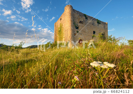 Scenic landscape of a medieval tower at sunset. 66824112