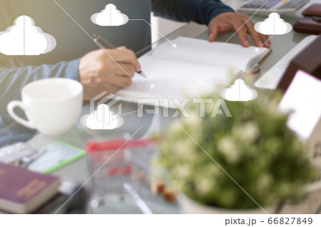 New Normal Concept. Defocus of Asian man writing data on notebook. Safety for Big data on Network by Cloud. New Normal Concept. Defocus of Asian man writing data on notebook. Safety for Big data on Network by Cloud. 66827849