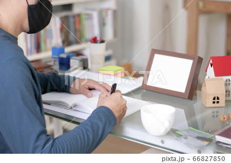 A man use mask at work place for Social distancing. A man use mask at work place for Social distancing. 66827850
