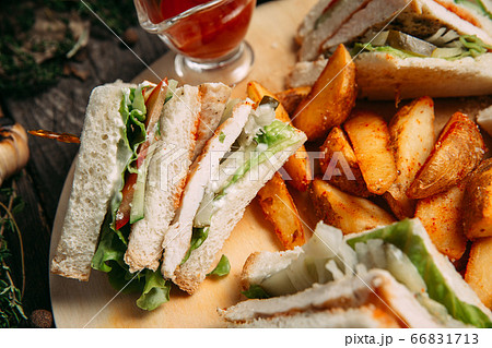 Sandwiches set with red sauce rustic potato wedges Sandwiches set with red sauce rustic potato wedges 66831713