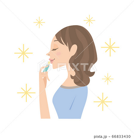 リップクリームを塗る女性のイラスト素材