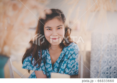 Beautiful Asian Chinese looking lady sitting in a Beautiful Asian Chinese looking lady sitting in a 66833660