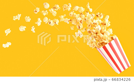 popcorn in classic bucket red and white splashing out of the box 66834226