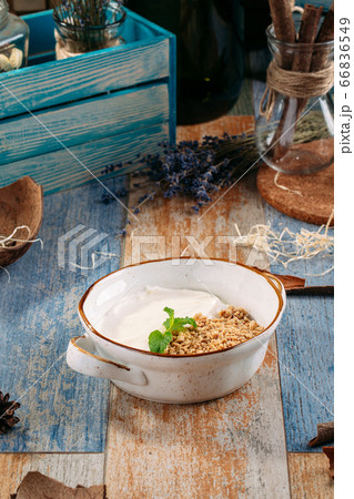 Breakfast homemade oatmeal granola with yogurt 66836549