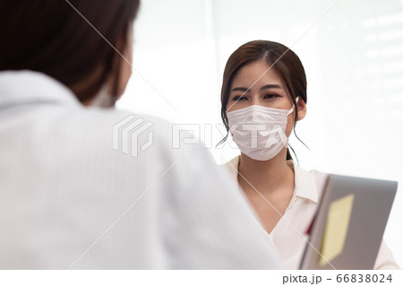 Asian business women talk about job and wear masks.New nomal 66838024