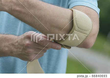Man wearing elbow brace Man wearing elbow brace 66840693