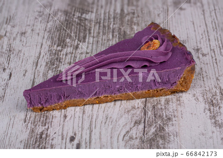 Piece of tart for vegetarians from kuraga and raisins, filled with nut cream and cashews Piece of tart for vegetarians from kuraga and raisins, filled with nut cream and cashews 66842173