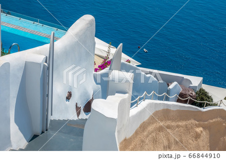 Traditional staircase to the sea between the white Traditional staircase to the sea between the white 66844910