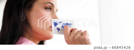 Beautiful female specialist shows a credit card Beautiful female specialist shows a credit card 66845426
