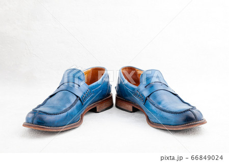 Pair of old leather blue discarded boots with laces Pair of old leather blue discarded boots with laces 66849024