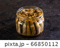 Glass open jar with slots on a concrete background 66850112
