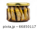 Glass jar of sprats on a white background isolate 66850117
