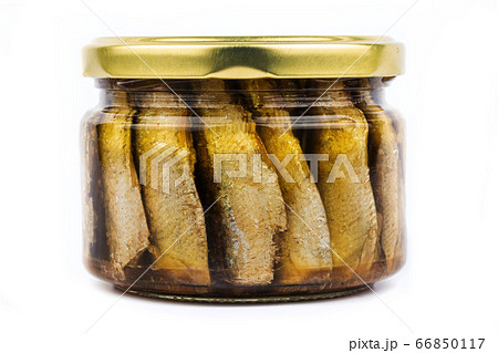 Glass jar of sprats on a white background isolate 66850117