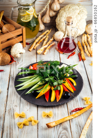 Caucasian snack fresh vegetables cheese and olives 66850162