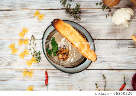 Top view gourmet mushroom cream soup with crouton 66850226