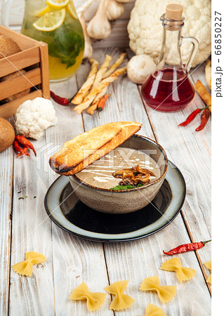 Side view gourmet mushroom cream soup with crouton Side view gourmet mushroom cream soup with crouton 66850227