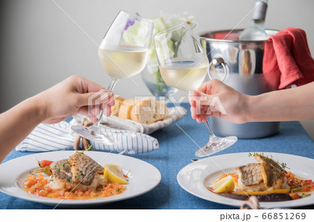 toasting with white wine over the luxury seafood 66851269