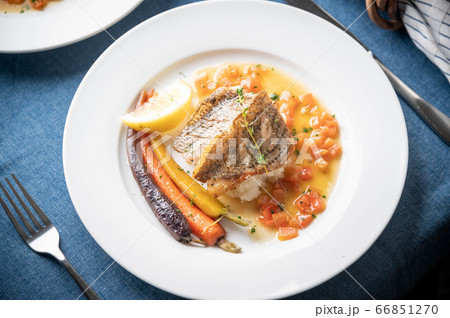 sea bass poele with white wine sauce, luxury 66851270