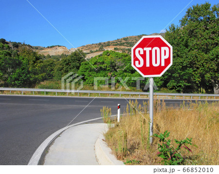 Stop sign before on main road 66852010