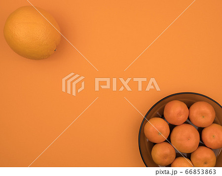 Organic citrus fruit on orange background close-up. 66853863