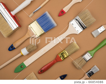 Building tool. Paint brushes. Beige background. The concept of repair. 66854086