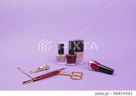 Set for care of nails on a violet background. Set for care of nails on a violet background. 66854091