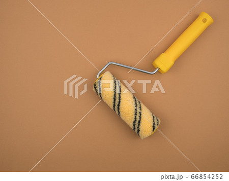 Paint roller on beige background. Construction tool. Paint roller on beige background. Construction tool. 66854252