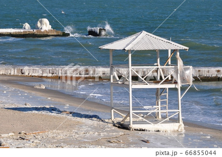 Abandoned Rescue Station. Beach tower on the Black Sea in winter Abandoned Rescue Station. Beach tower on the Black Sea in winter 66855044
