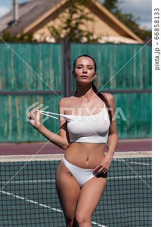 Sexy woman in underwear on tennis court - Stock Photo [66858133] - PIXTA